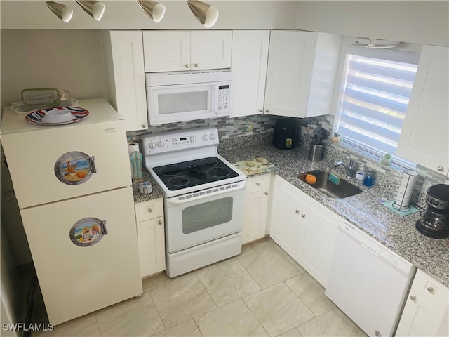 kitchen featuring light stone counters, white cabinets, sink, tasteful backsplash, and white appliances