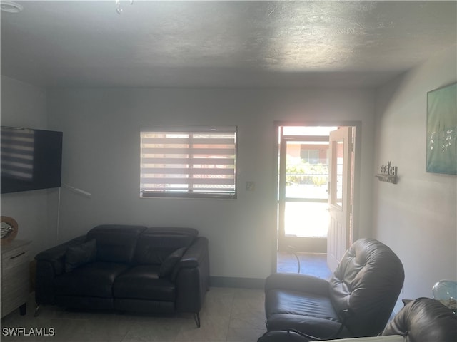 living room with a textured ceiling