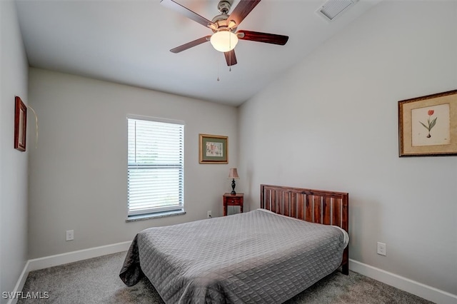 carpeted bedroom featuring ceiling fan and vaulted ceiling