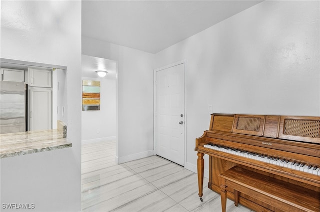 misc room featuring light tile patterned floors