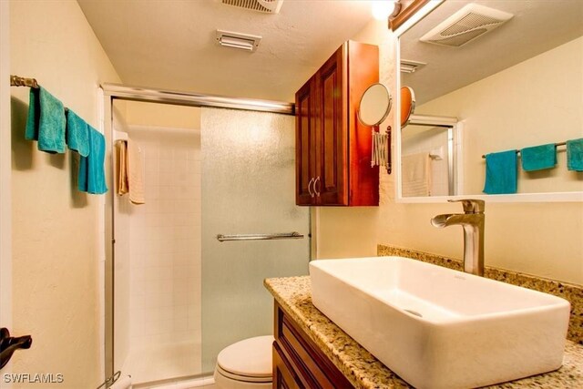 4906 Victoria Dr Unit 413, Cape Coral, FL 33904 - full bathroom featuring a shower stall, toilet, and vanity