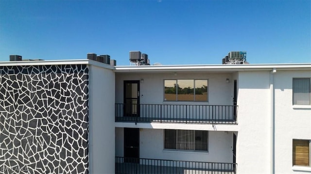 4906 Victoria Dr Unit 413, Cape Coral, FL 33904 - view of property featuring central AC unit