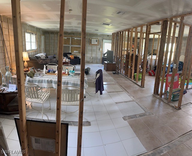 miscellaneous room with light tile patterned floors