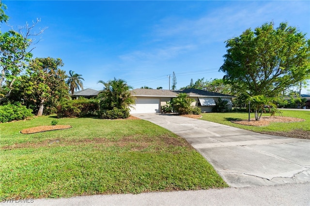 view of front facade with a front yard and a garage