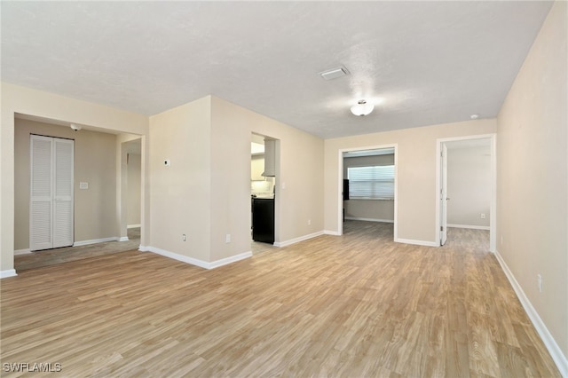 unfurnished living room with light hardwood / wood-style flooring