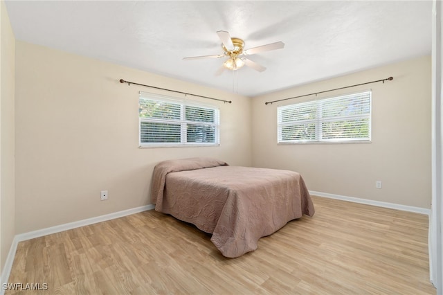 bedroom featuring ceiling fan and light wood-type flooring