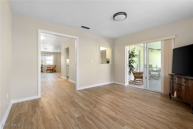 unfurnished living room featuring light wood-type flooring