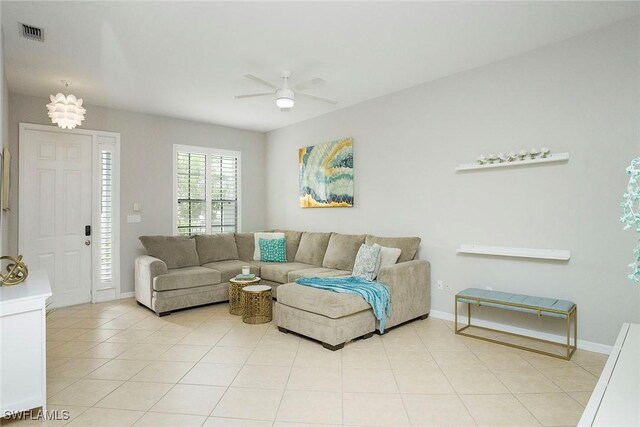 living room with ceiling fan and light tile patterned floors