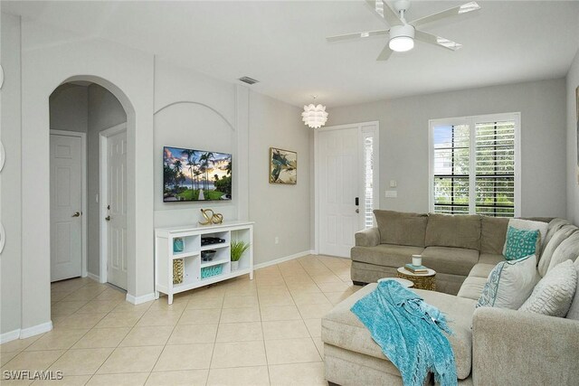 living room with ceiling fan and light tile patterned floors