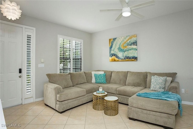 tiled living room featuring ceiling fan