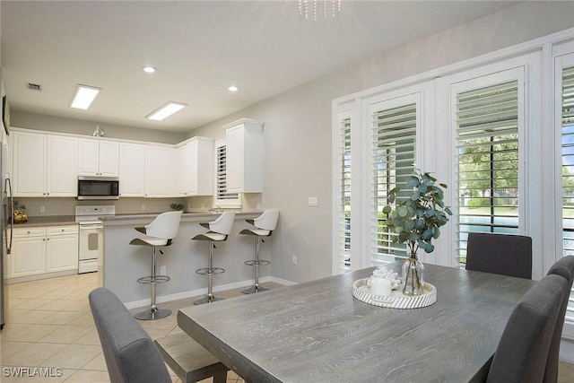 dining area with recessed lighting, visible vents, and light tile patterned floors