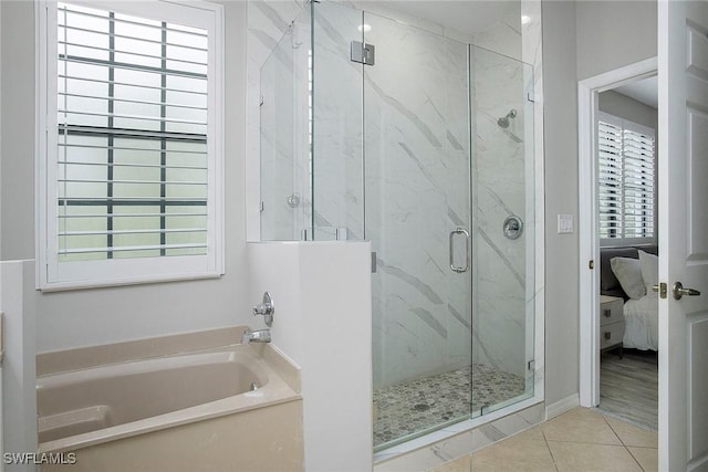 ensuite bathroom with a marble finish shower, connected bathroom, tile patterned flooring, and a bath