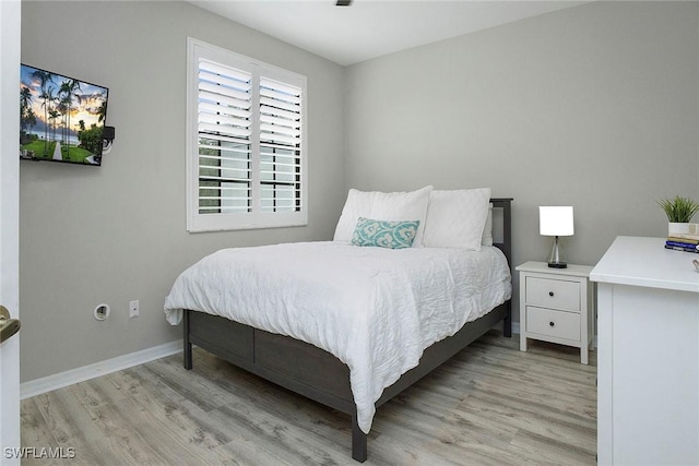 bedroom featuring light hardwood / wood-style floors