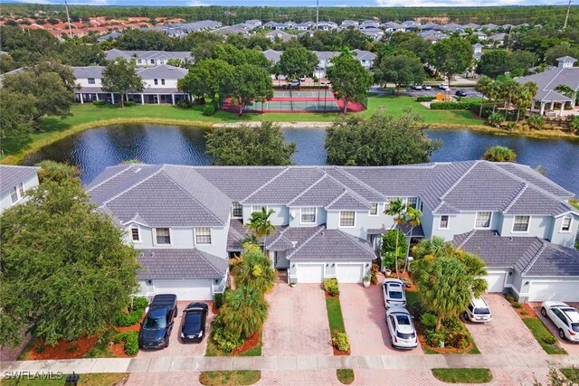 aerial view with a residential view and a water view
