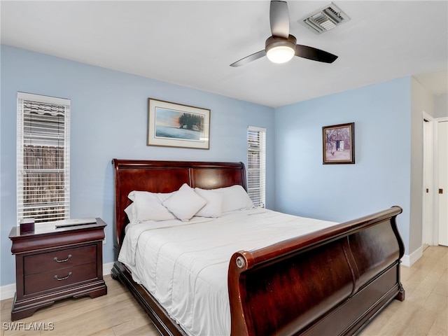 bedroom featuring ceiling fan and light hardwood / wood-style floors