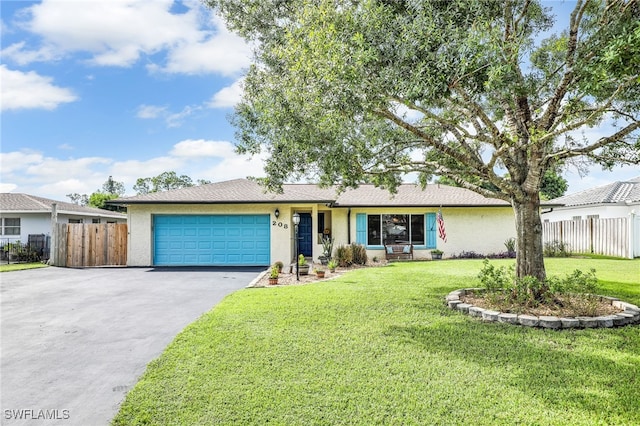 single story home featuring a garage and a front yard