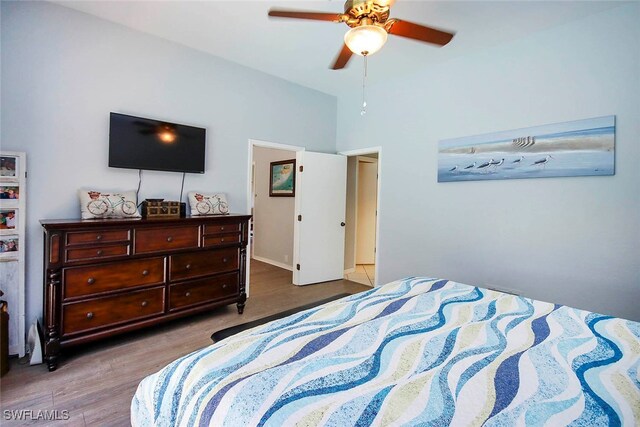 bedroom with ceiling fan and hardwood / wood-style floors