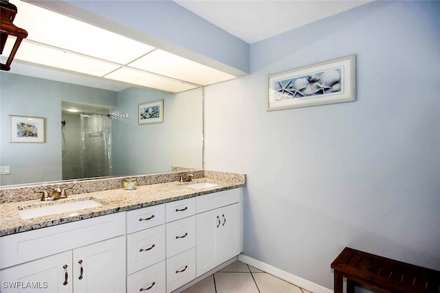 bathroom featuring vanity, a shower, and tile patterned flooring