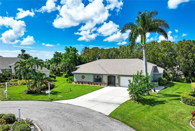 single story home with a front lawn and a garage