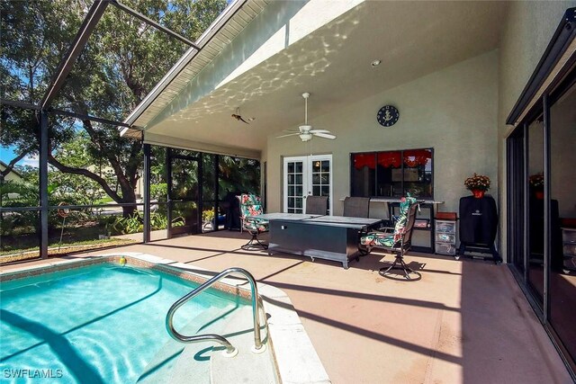 view of pool with a patio, a jacuzzi, a lanai, and ceiling fan