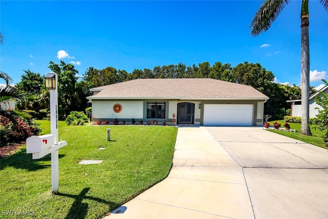 view of front of house featuring a front yard and a garage