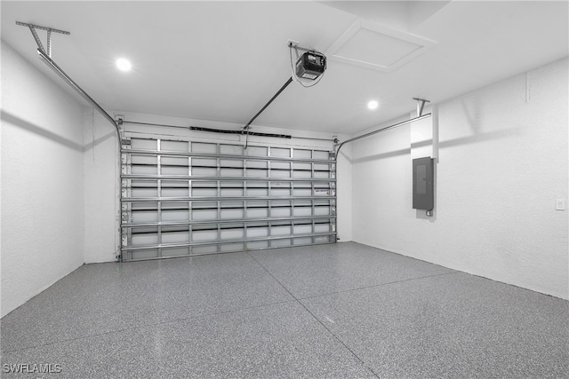 garage with electric panel and a garage door opener