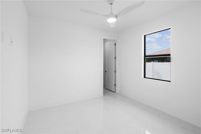 unfurnished room with ceiling fan