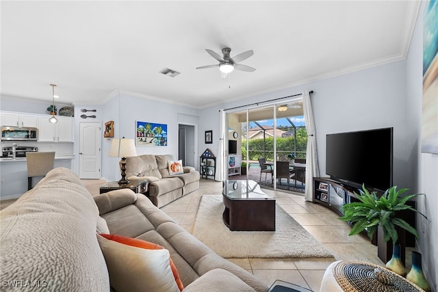 tiled living room featuring ceiling fan and ornamental molding