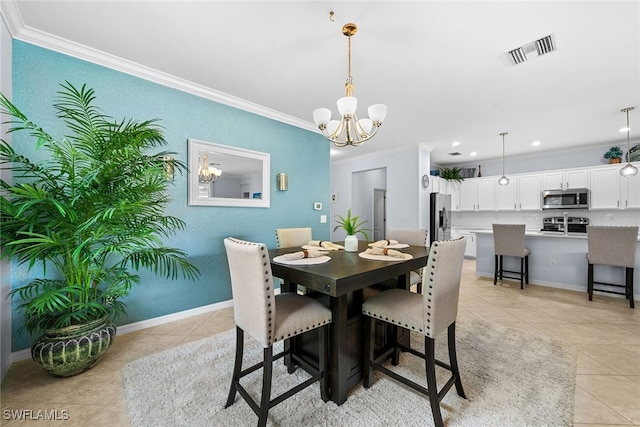 tiled dining room with an inviting chandelier and ornamental molding