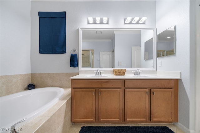 bathroom featuring tile patterned flooring, shower with separate bathtub, and vanity