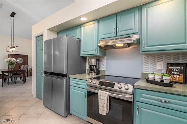 kitchen with decorative light fixtures, stainless steel appliances, backsplash, and light tile patterned floors