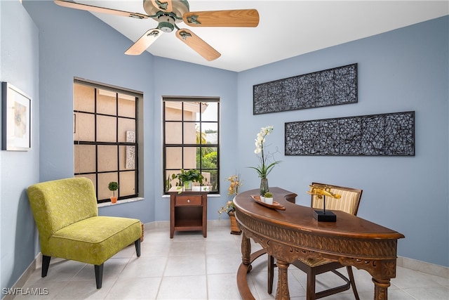 office area with ceiling fan, light tile patterned flooring, and lofted ceiling