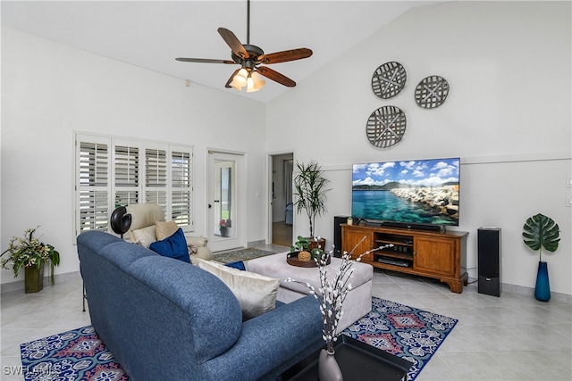 living room with light tile patterned flooring, high vaulted ceiling, and ceiling fan