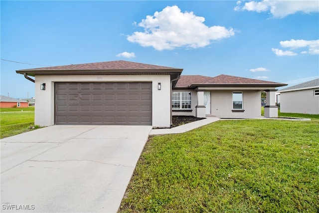 view of front of property with a garage and a front yard