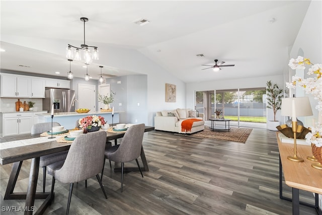 dining area featuring ceiling fan, dark hardwood / wood-style floors, and vaulted ceiling