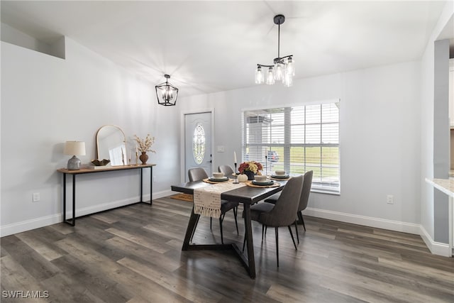 dining room featuring a notable chandelier and dark hardwood / wood-style floors