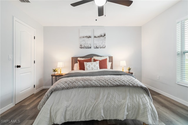 bedroom featuring ceiling fan and dark hardwood / wood-style flooring