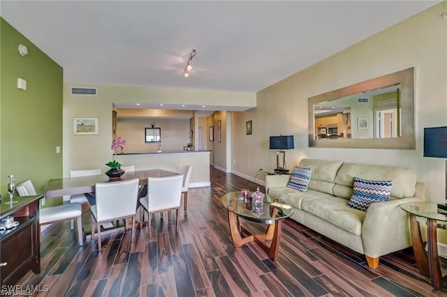 living room with dark wood-type flooring