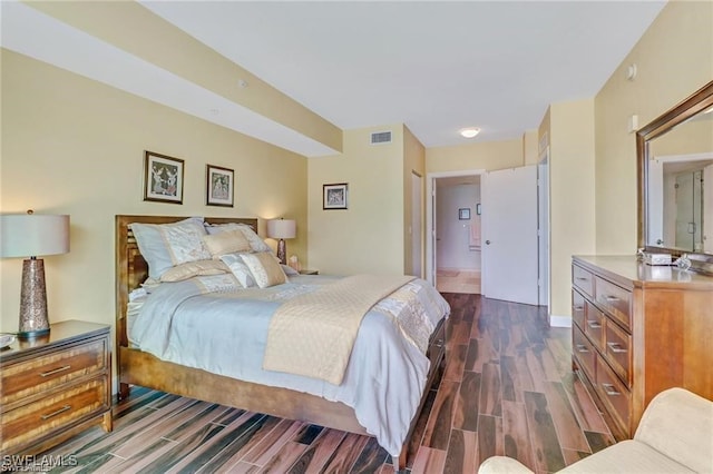 bedroom featuring dark hardwood / wood-style flooring