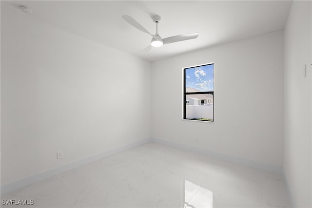 spare room with ceiling fan