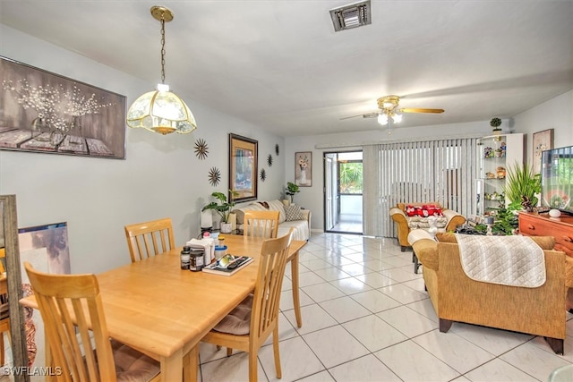 dining room with ceiling fan and light tile patterned flooring