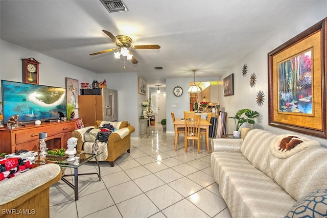 living room with light tile patterned floors and ceiling fan