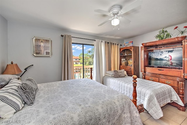 bedroom with ceiling fan, light tile patterned floors, and access to exterior