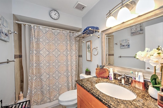 bathroom with vanity, toilet, and a shower with shower curtain