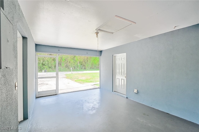 spare room with concrete floors