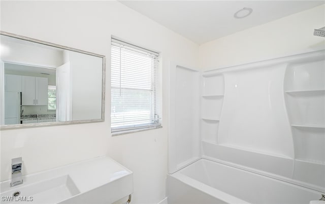 bathroom with shower / bathtub combination and vanity