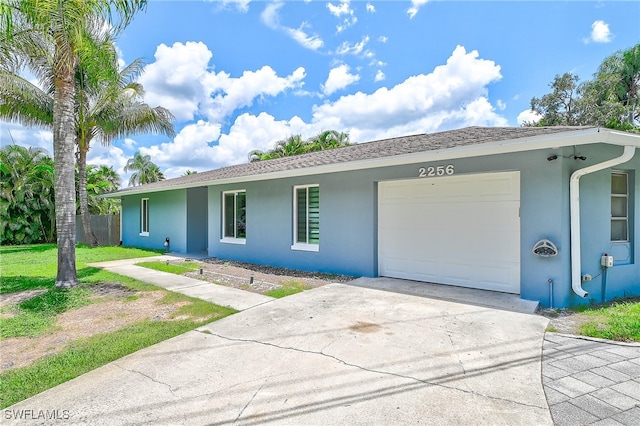 ranch-style home featuring a garage