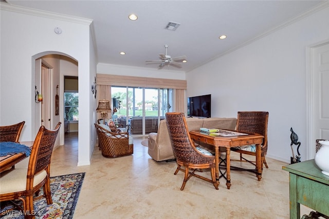 dining space with ceiling fan and crown molding