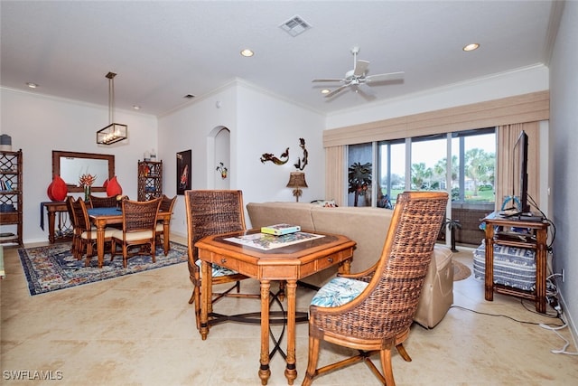 dining area featuring crown molding and ceiling fan