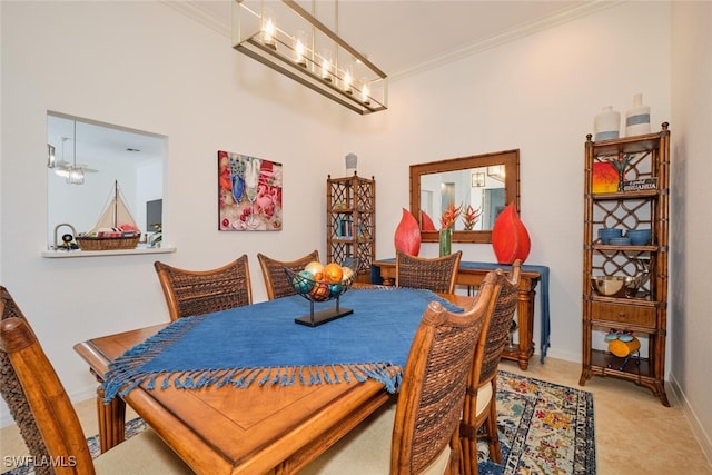 dining room featuring crown molding and a notable chandelier